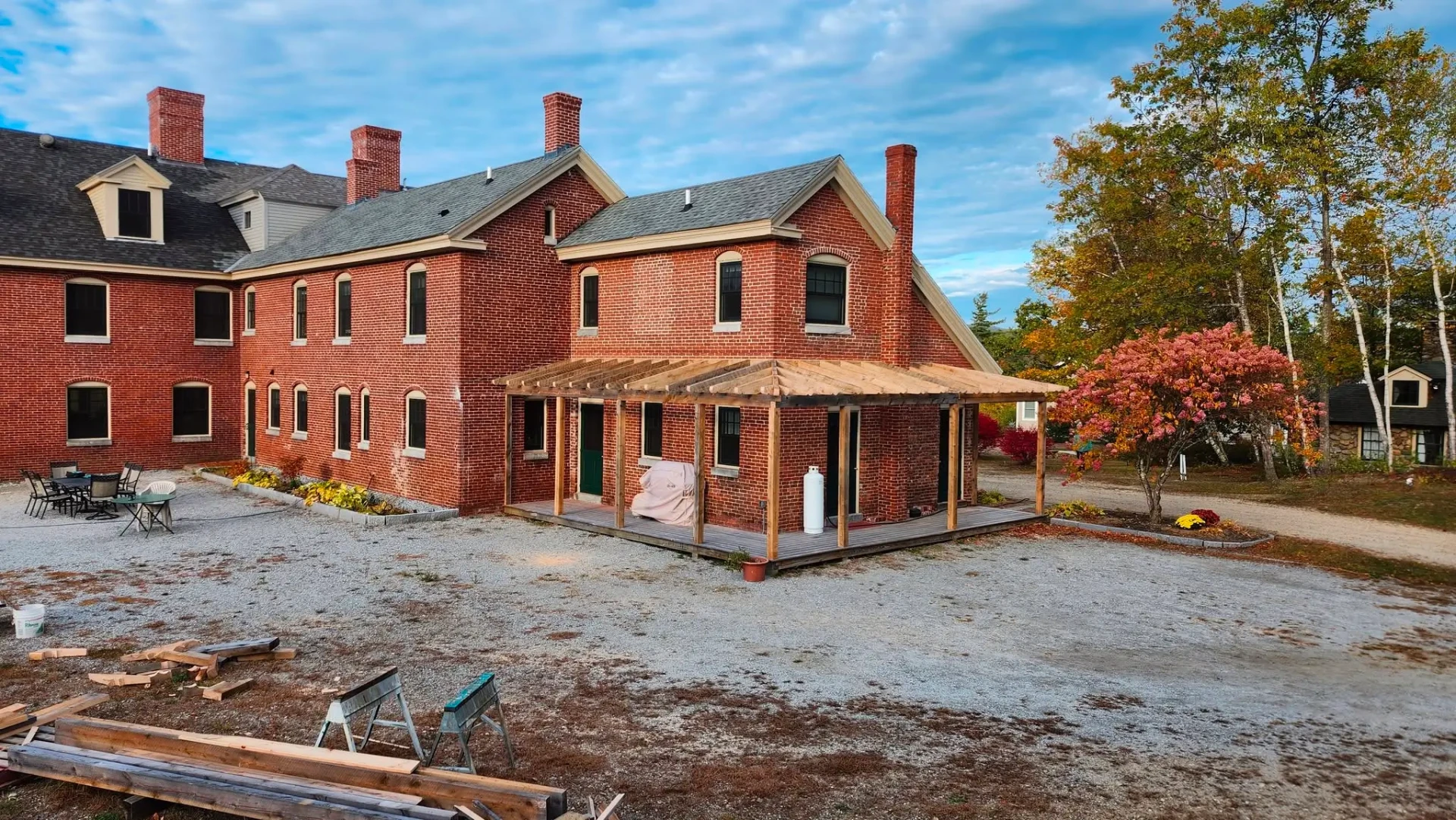The brick Red Hill Inn under restoration on a clear summer day